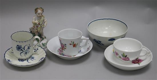 A Derby putto, a Worcester cup and saucer, a Berlin cup and saucer and three other items